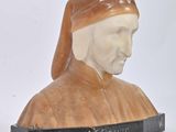 marble bust of a man wearing a red cap and a brown robe