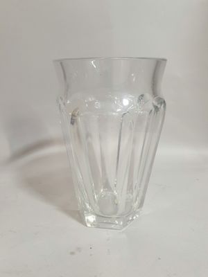 a glass cup that is sitting on a table
