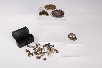 a small box with a bunch of jewelry inside of it