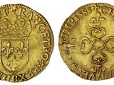 une pièce d'or surmontée d'une couronne