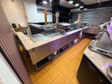 a picture of a restaurant kitchen with a lot of counter space