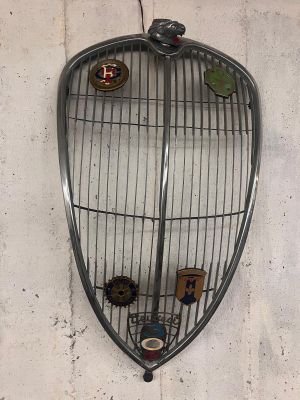 a picture of a bird cage hanging on a wall