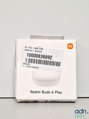 a box of redmi buds and play on the table