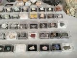many different kinds of rocks and minerals in the display