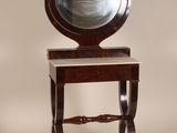 an image of a wooden vanity with a mirror on it