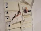 a lot of books that are stacked on top of each other