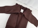 the sweater is brown and has a white tag on it