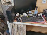 a desk with a computer and a printer on it