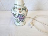 a lamp that is sitting on a table with a cord