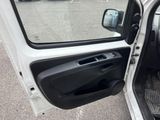doorway view of a car with the door open and the driver ' s seat down