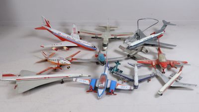 a lot of toy airplanes that are sitting on the floor