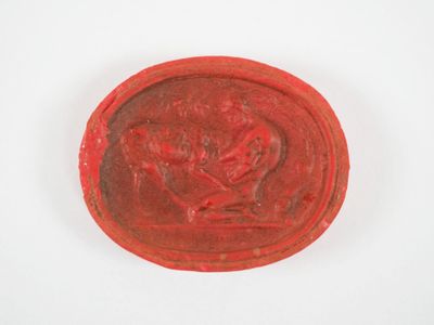 une image représentant un cachet de cire rouge orné d'un cheval