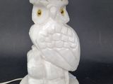 a white owl lamp with a white shade on it ' s head