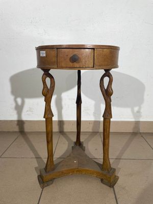 a small table with a drawer on top of it