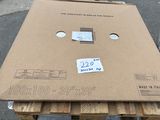 a cardboard box on a pallet with a price tag on it
