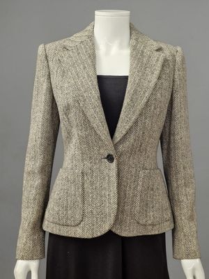 a woman ' s jacket and skirt suit on a mannequin mannequin mannequin mannequin mannequin mannequin mannequin mann