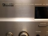 a close up of a silver stereo system on a table