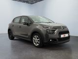 the grey citrole is parked in a large room