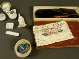 a box with a bottle of wine and other items on a table