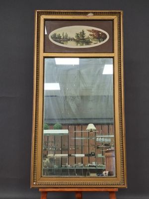 an image of a mirror on a stand with a painting on it
