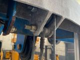 a close up view of a crane in a warehouse