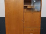 an image of a wooden cabinet with a glass door