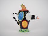a black and white teapot with a colorful design on it