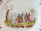 a plate with a picture of a man and a woman on it