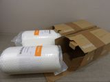 two rolls of bubble wrap sitting on top of a cardboard box