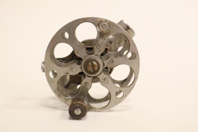 a metal object that is sitting on a white surface