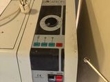a machine that is sitting on the floor next to a wall