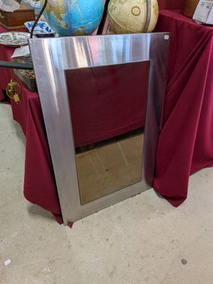a picture of a table with a mirror and a globe on it