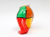 a figurine of a colorful elephant with a red nose