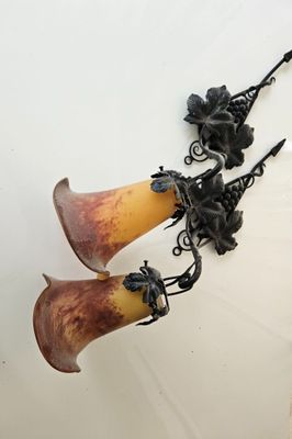 two vases that are hanging on the wall