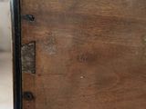 a close up of a drawer with a wooden drawer underneath it