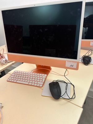 a computer on a desk with a keyboard and mouse