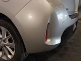 a close up of a car ' s rear end with the door open