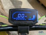 a digital clock on the handlebar of a bike