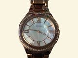 an image of a close up of a wrist watch on a white background