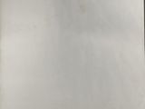 someone is holding a piece of paper with a drawing on it