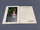an open book with a picture of a woman in a bathing suit