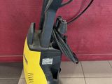 a close up of a yellow and black pressurer on a tiled floor