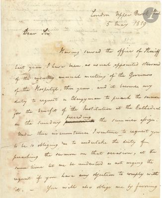 lettre manuscrite écrite à l'encre noire sur une feuille de papier