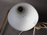 a lamp that is sitting on a table next to a cord