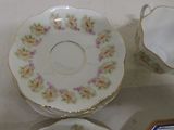 three cups and saucers sitting on a table