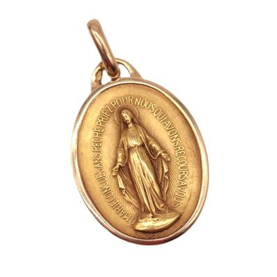 a close up of a gold medal on a white background