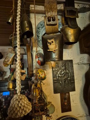 a lot of items hanging from the ceiling in this room
