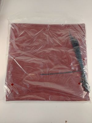 a plastic bag on the table with a brush in it