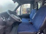 a blue seat cover in the back of a van