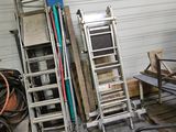 a pile of junk in a garage next to a ladder